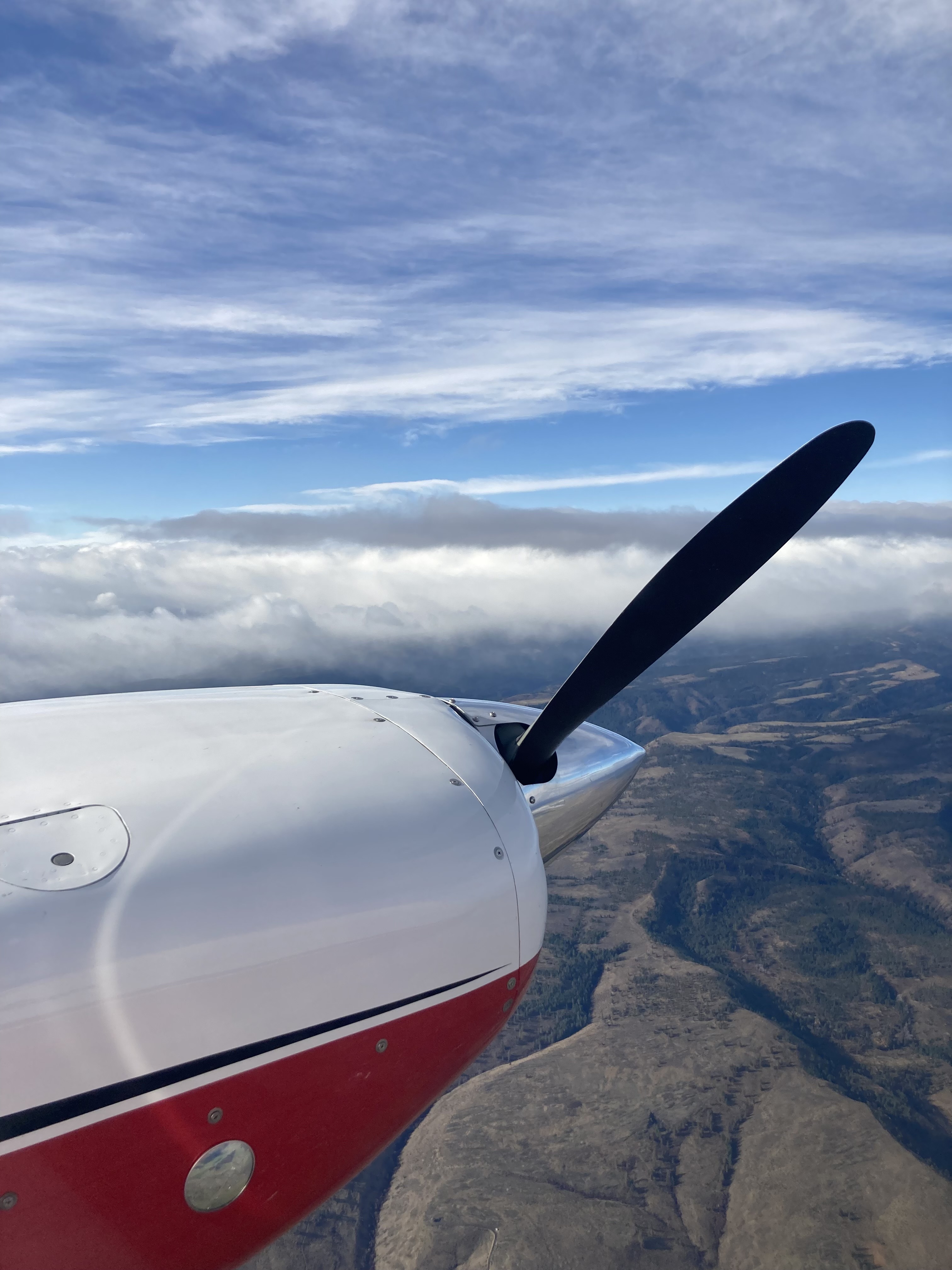 image of an airplane prop stoped mid air in a beutiful day